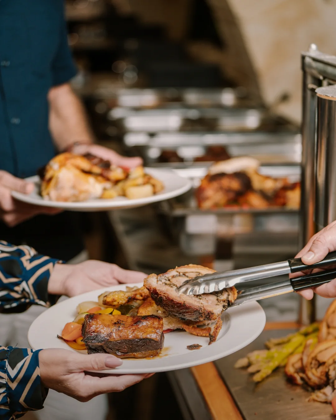 A guest being served at the Sunday roast buffet